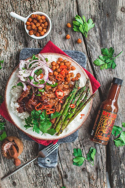 spicy buddha bowl with hot sauce