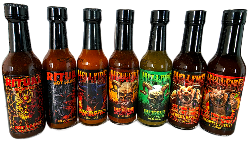 Row of hot sauce bottles with various labels on a black background